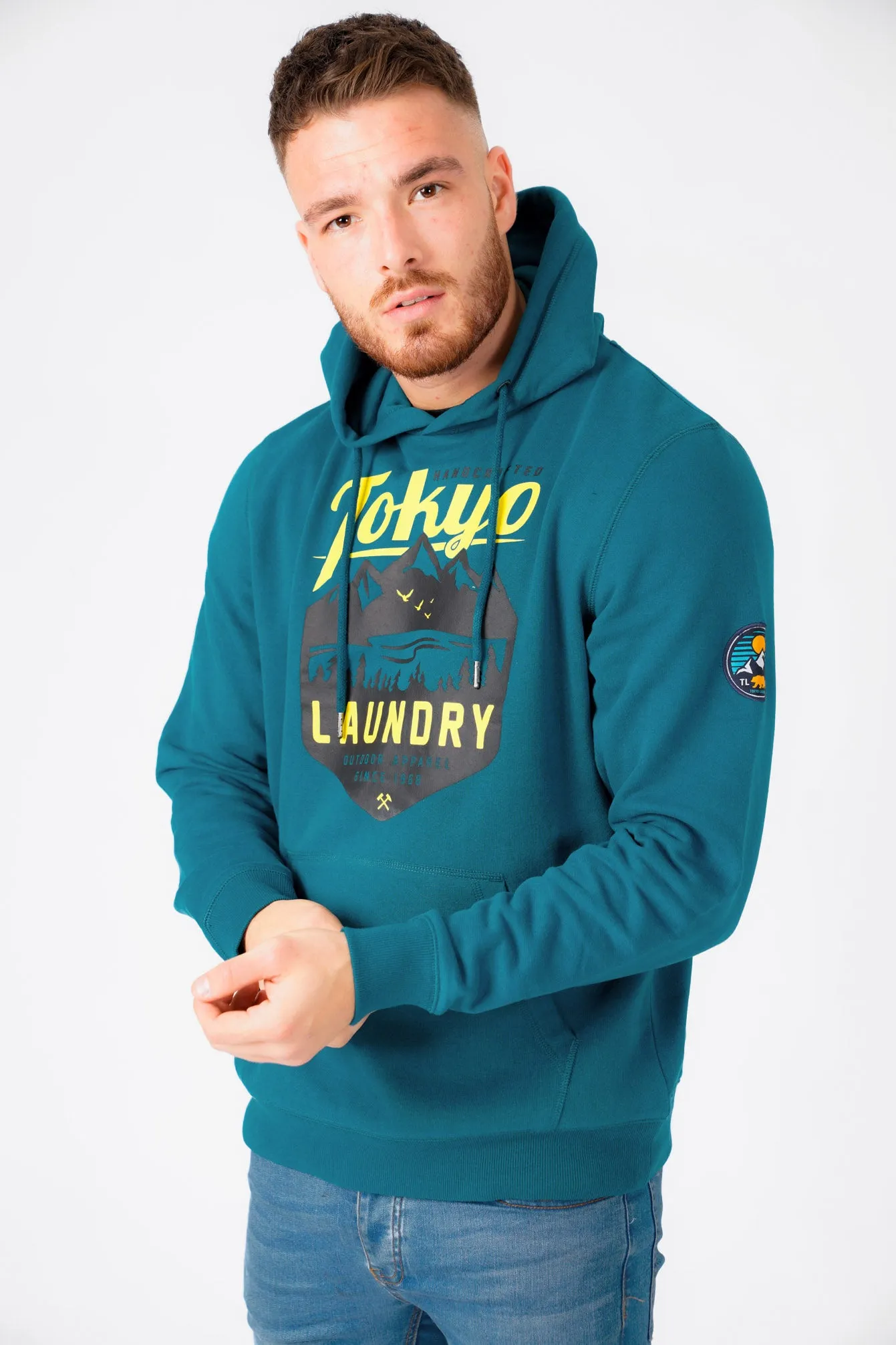 Calegreen Outdoor Motif Brush Back Fleece Pullover Hoodie In Moroccan Blue - Tokyo Laundry